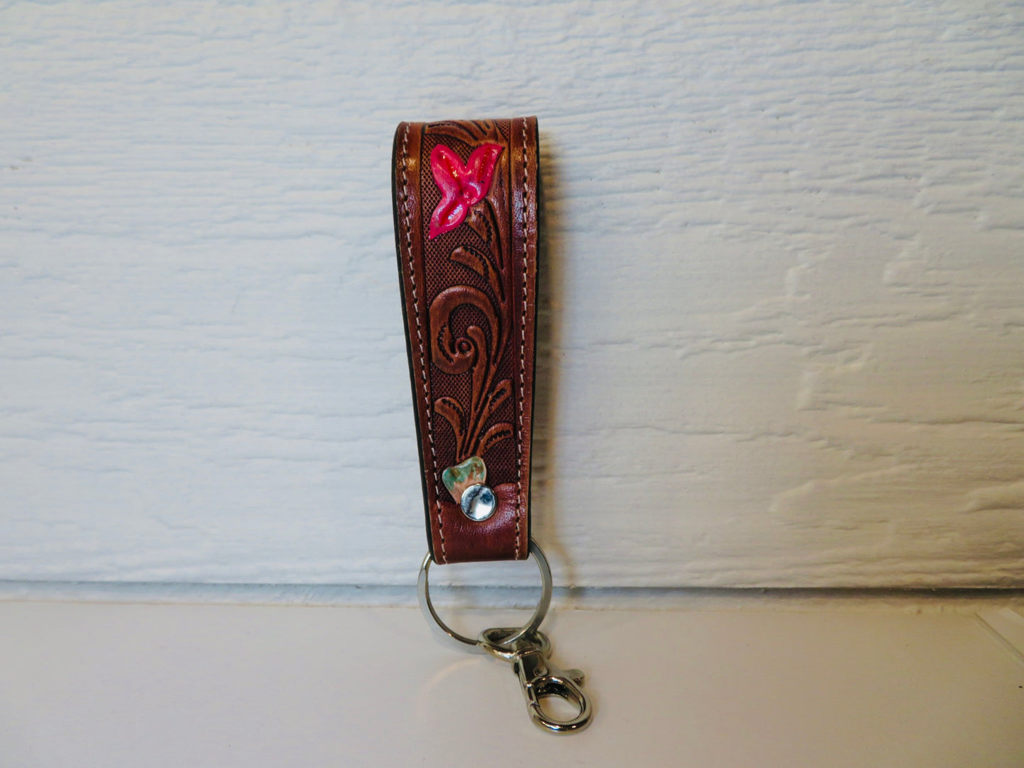 Brown tooled leather with painted flowers