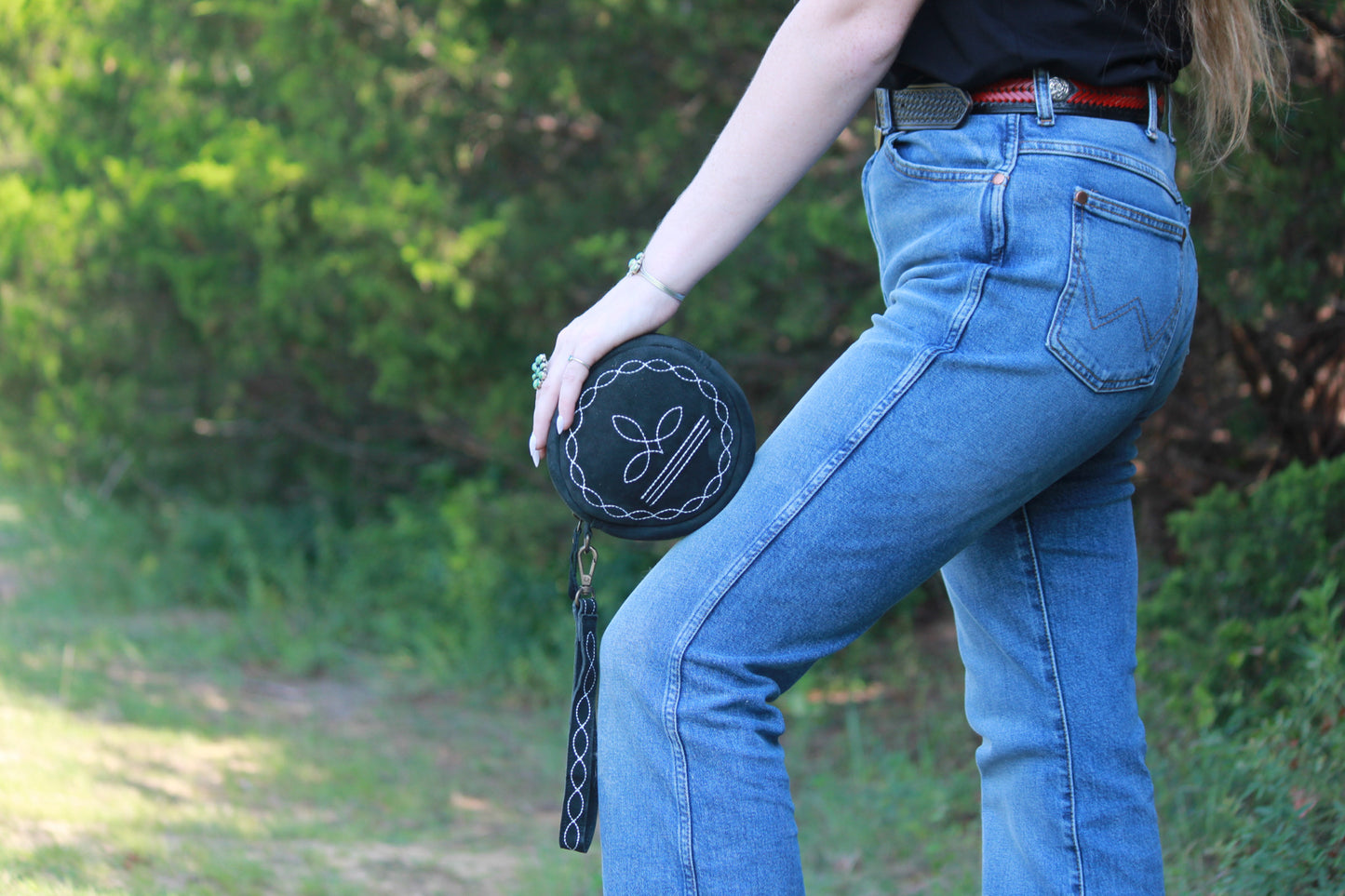 Black bootstitch wristlet