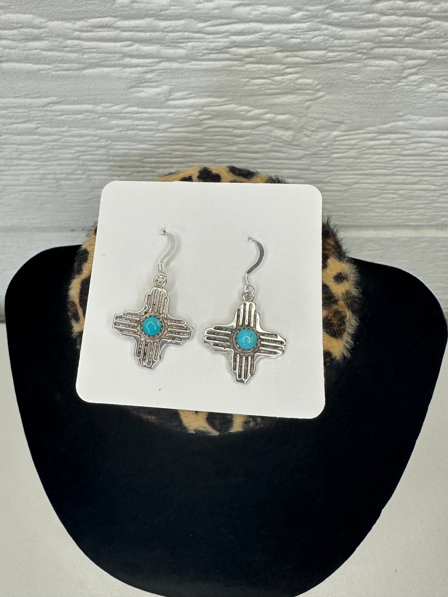 The sterling silver and turquoise Zia
