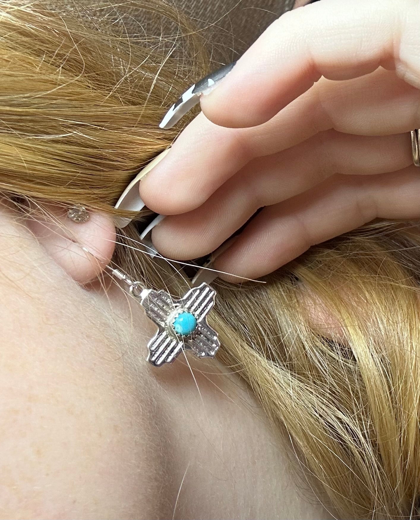 The sterling silver and turquoise Zia