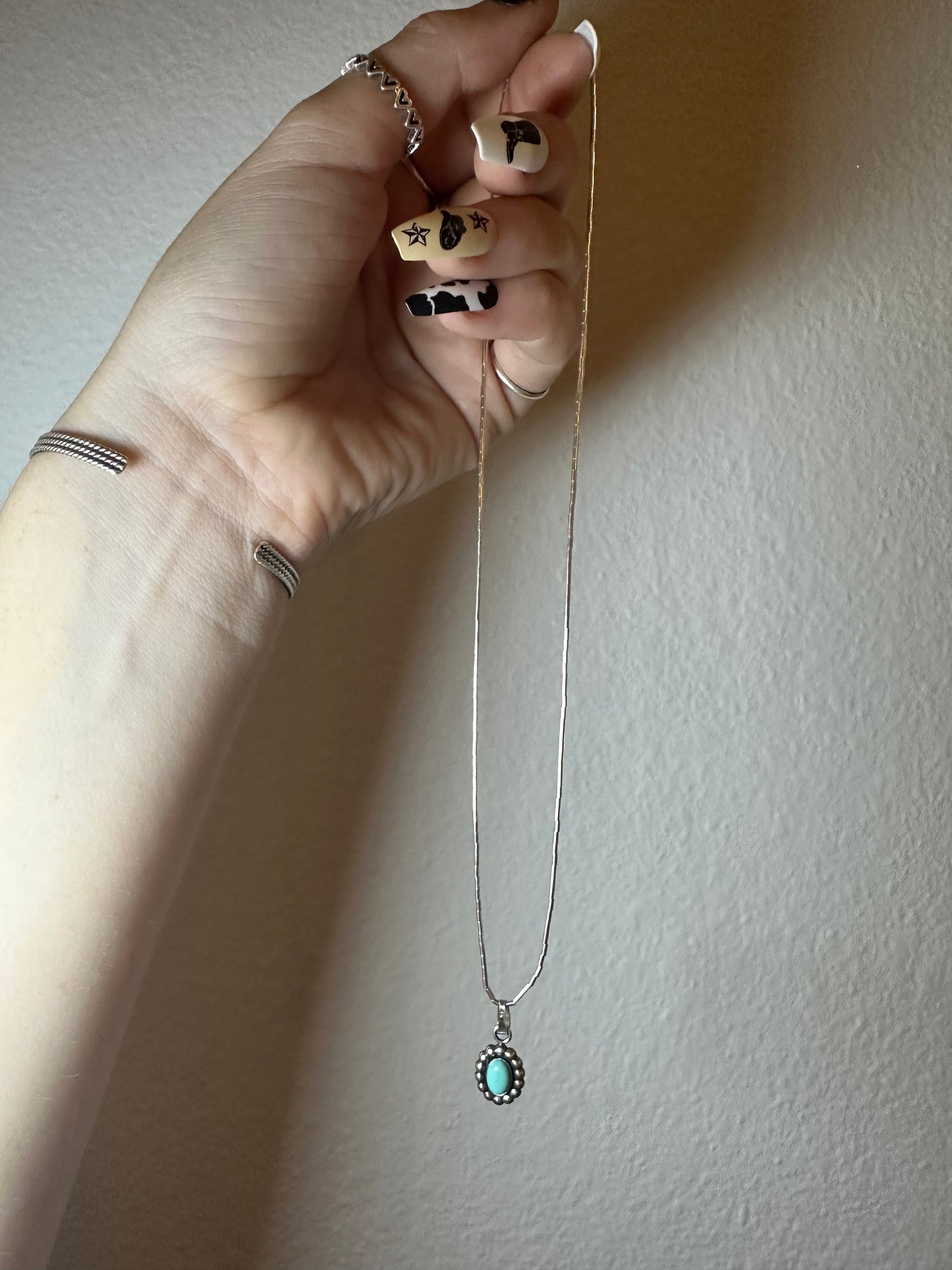 The cutest little turquoise concho