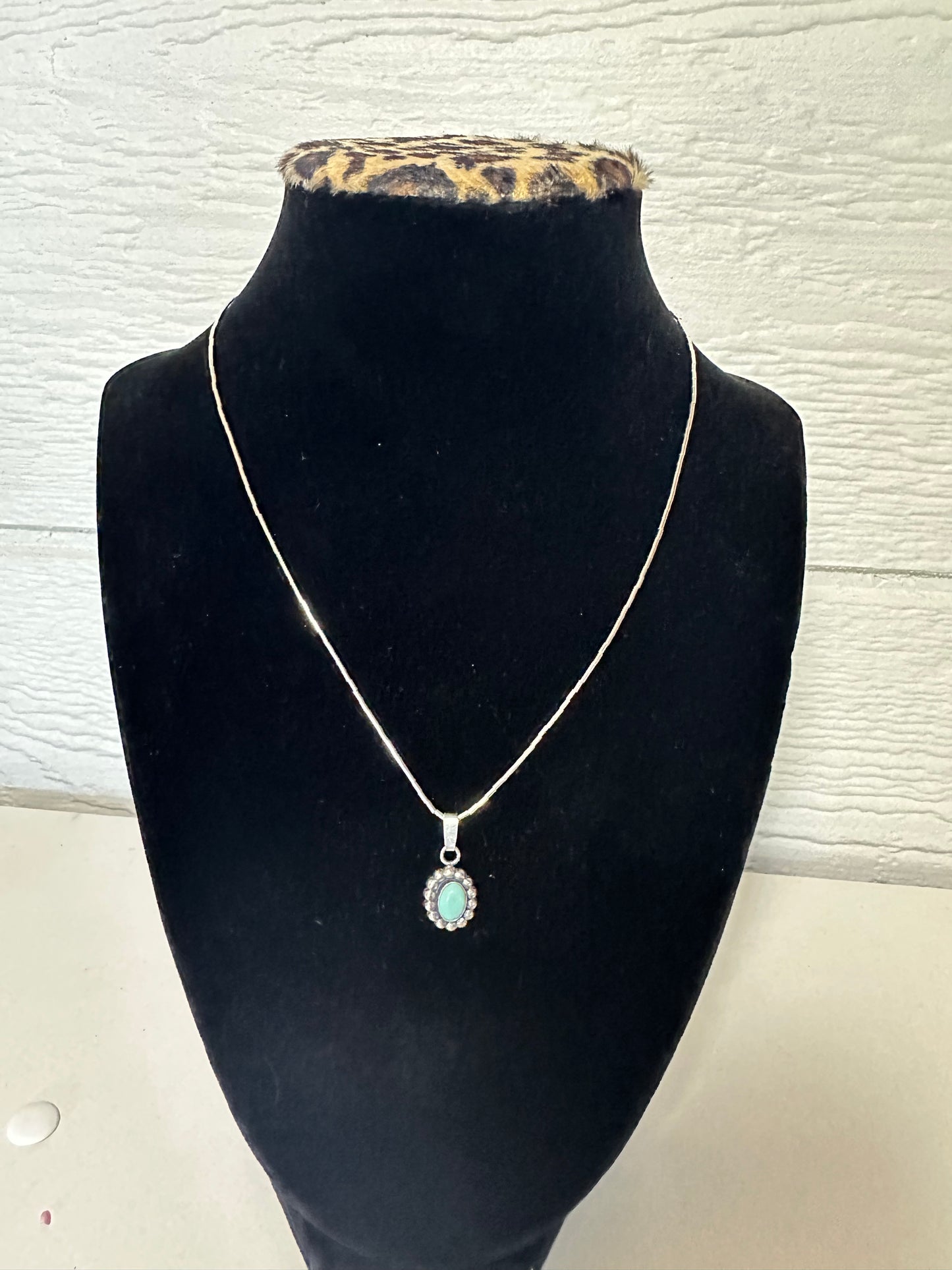 The cutest little turquoise concho
