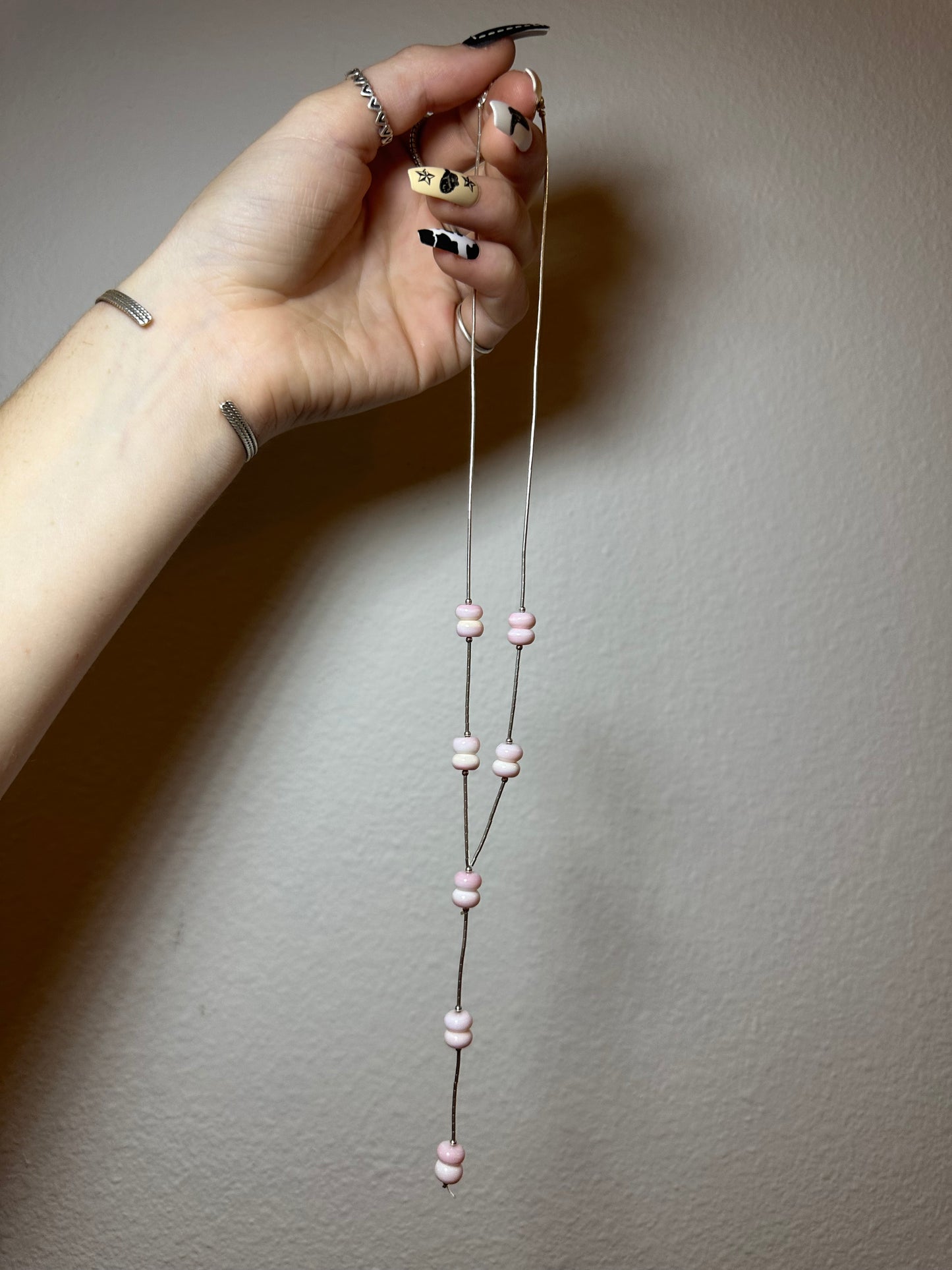 Pink conch lariat